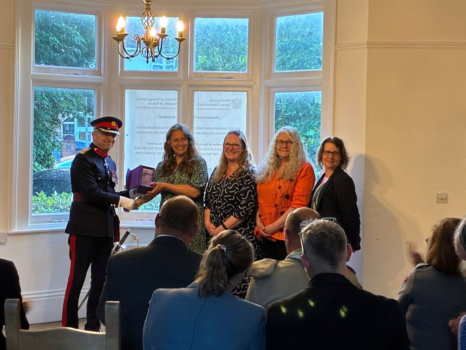 Ealing Repair cafe being presented with the Kings voluntary award by Richard Kornicki CBE DL, Representative Deputy Lieutenant for the London Borough of Ealing. From left to right Mary, Lone, Yvonne and Jenny